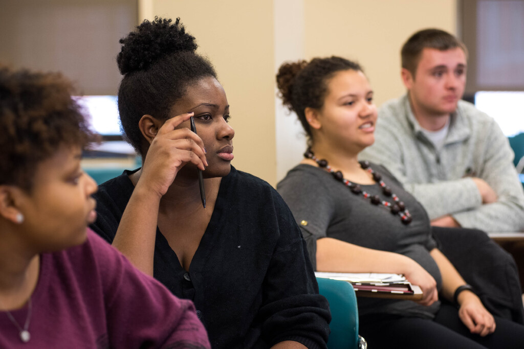 Attentive students focus in a classroom.