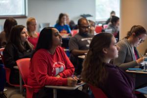 Ohio State students sit attentively in a classroom.