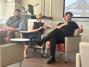 Associated Faculty from the Department of English participate in a Q&A session at a mini-conference.